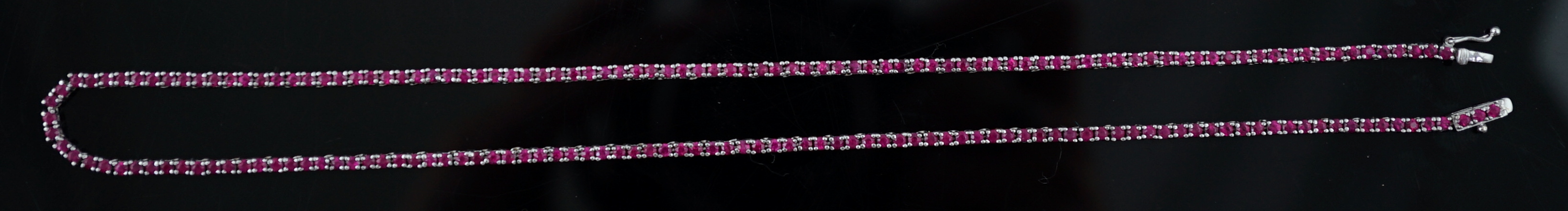 A modern 18k white gold and ruby set line necklace